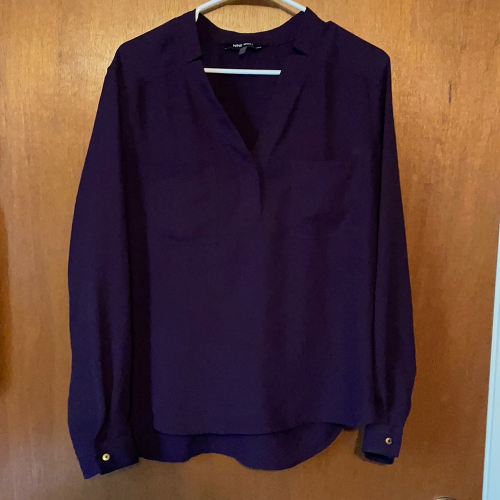 Purple blouse with chest pockets and gold sleeve buttons